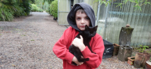 Max Mitchel finds a stray cat at the end of Coquette Point Road